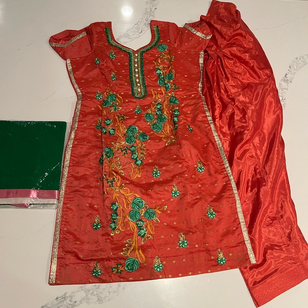 Silk blend salwaar kameez suit with embroidery and decorative details